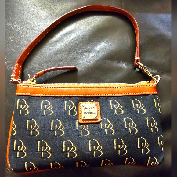 Dooney & Bourke Handbags - Dooney and Bourke Greta Canvas Large Wristlet in Black with Gold DB Logo EUC